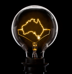 Clear Light-bulb with a glowing wire filament in the shape of Australia.